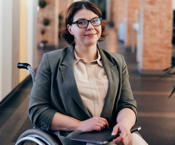 Young womain sitting in wheelchair smiling